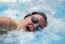 Rylee Erisman celebrates winning gold in Women’s 100m Freestyle